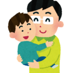 子どもを抱っこするお父さん