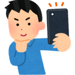 自撮りする男