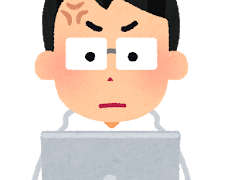 パソコンを見て怒っている人
