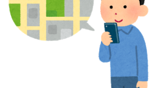 携帯で地図を見る男