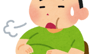 満腹で苦しそうな男性